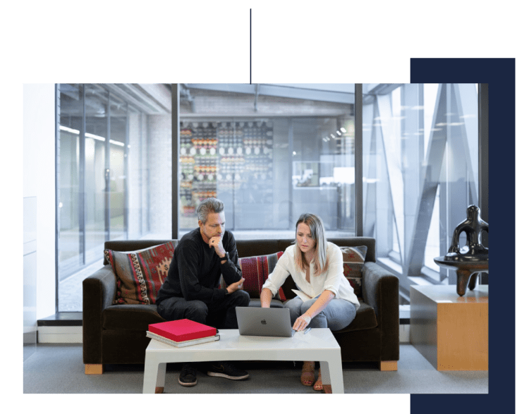 Man and woman sitting on couch